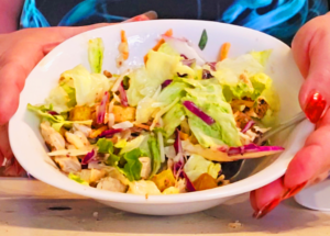 Grilled chicken salad made from a grilled chicken breast fillet and a partial bag of a store bought sandwich kit